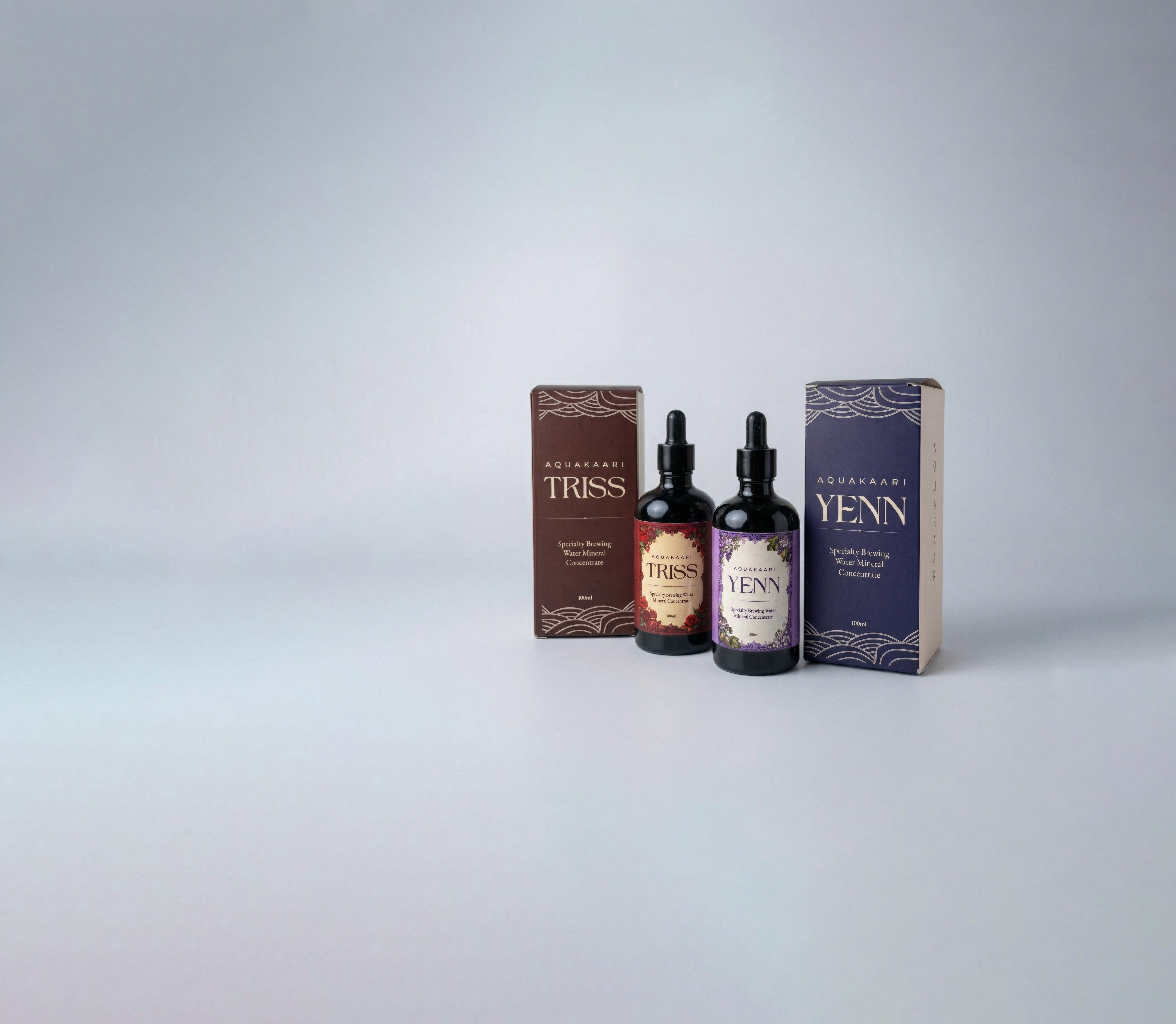 Two bottles and their boxes labeled 'Triss' and 'Yenn' on a light gray background